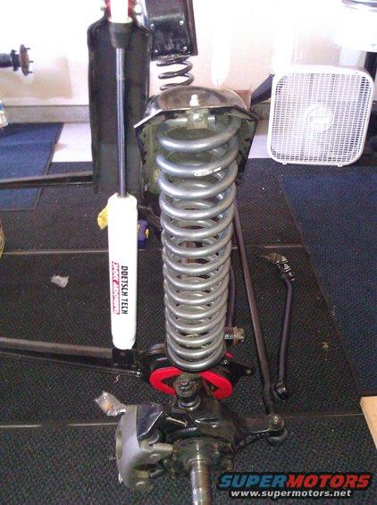 Suspension assembly with Doetsch Tech shock and coil spring. Part of a vehicle's front end