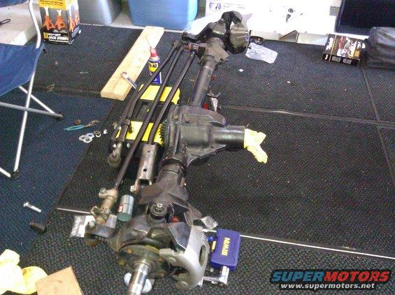 Front axle assembly with yellow tape on differential housing