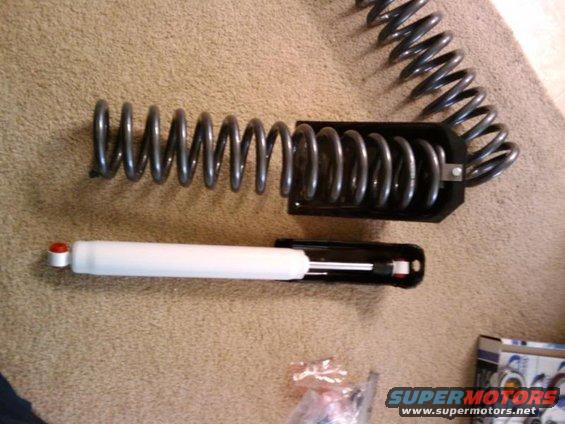 Coil spring and shock absorber on carpet