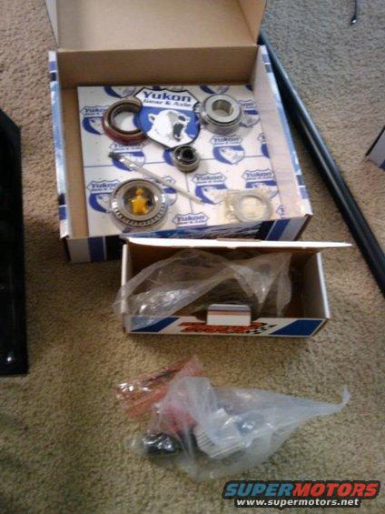 Yukon Gear & Axle bearing kit and other parts in opened boxes on carpet