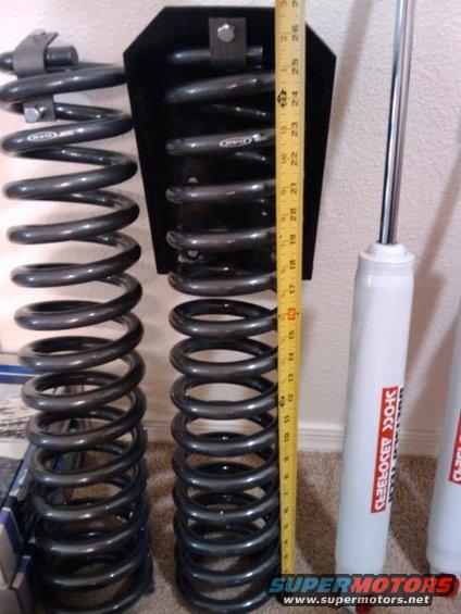 Two suspension springs and shock absorbers with a measuring tape