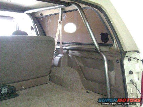 Interior view of a roll cage in a vehicle's cargo area