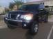 2008 Nissan Titan - This black 2008 Nissan Titan pickup truck is shown from a 3/4 front angle.
