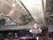 2008 Nissan Titan - The underside of a vehicle is captured, revealing the exhaust system and suspension parts. A Supermotors.net watermark is present.