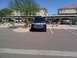 2008 Nissan Titan - A dark blue 2008 Nissan Titan pickup truck is parked in a lot with other vehicles visible in the background.