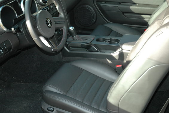 Black leather interior with bucket seats and a manual shifter