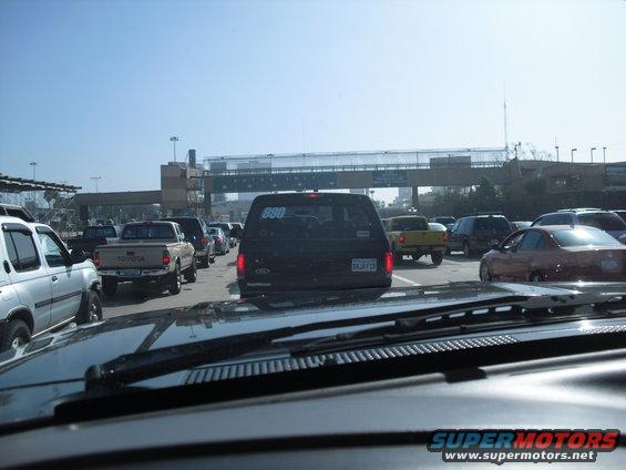Black SUV with '880' on rear window in traffic
