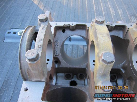 Engine crankshaft bearing housing with "HP 428" cast into it
