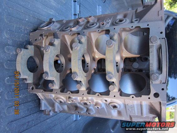 Engine block with bearing caps installed. Date stamp visible
