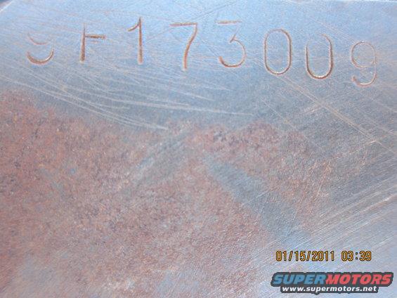 Stamped metal part with numbers SF173009