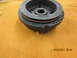 1969 Ford Mustang - Close-up of a crankshaft pulley, likely for an older vehicle, with visible part markings.