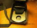 1969 Ford Mustang - Close-up of a seatbelt buckle mechanism, showing the internal components and visible markings.