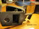 1969 Ford Mustang - A close-up view of a seatbelt buckle with a visible manufacturer's tag.