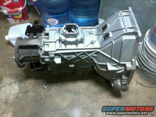 Silver transmission part on concrete floor