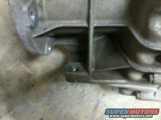 close-up of a metal transmission housing with bolts