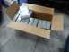 1993 Mazda MX-3 - A cardboard box is filled with multiple boxes of NGK spark plugs.