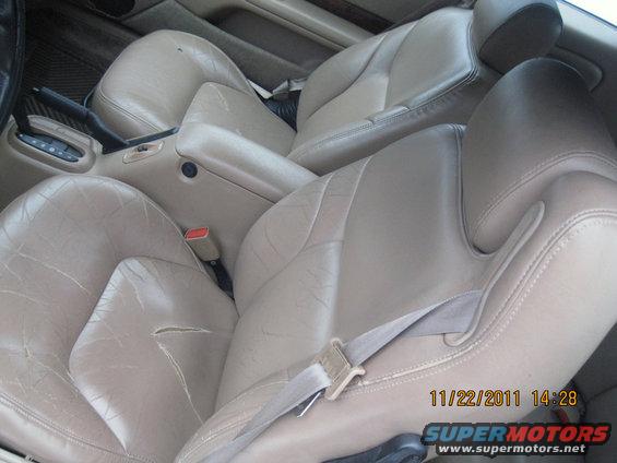 Tan leather bucket seats and center console interior. Date stamp reads 11/22/2011