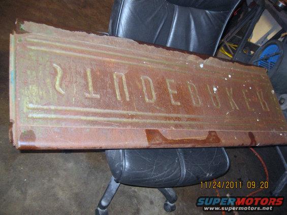 Rusty tailgate with "STUDEBAKER" embossed
