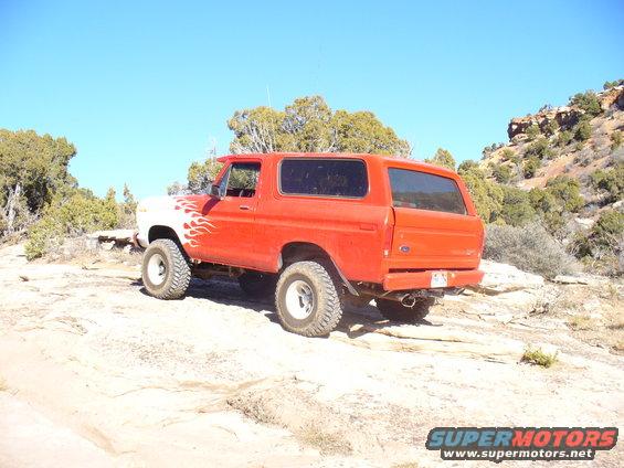 1979 Ford Bronco, red with white flames, 3/4 front view off-road