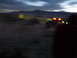 1986 Ford Bronco - Off-road vehicles are visible in a desert scene as daylight fades.