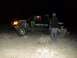 1986 Ford Bronco - A custom off-road truck sponsored by Monster Energy is seen at night in a desert landscape.