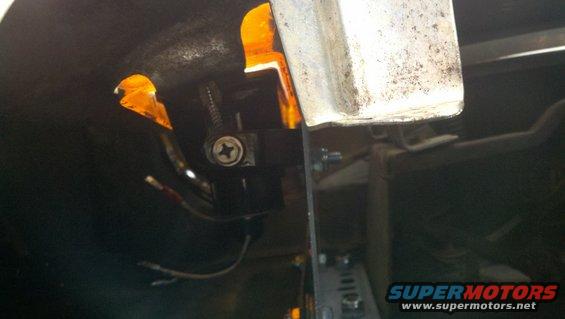Custom fog light wiring with orange tape and screw mount