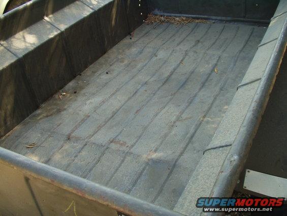 Truck bed interior with ribbed floor and textured sides