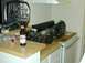 1996 Ford Bronco - Transmission parts are laid out on a kitchen counter next to a bottle of beer.