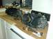 1996 Ford Bronco - Disassembled vehicle drivetrain components are laid out on a countertop, possibly for repair or inspection.
