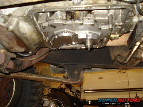 Underside view of a vehicle's transmission pan and exhaust system
