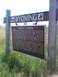 2007 Dodge Caliber - A signpost in a grassy field displays information about Devils Tower in Wyoming.