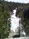 2007 Dodge Caliber - A scenic view of a waterfall flowing through a forested canyon.