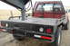 1994 GMC Sierra 3500 - Rear view of a red 1994 GMC Sierra 3500 flatbed truck with a gooseneck hitch.