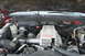 1994 GMC Sierra 3500 - The engine bay of a vehicle, a prominent 'Turbo Power' cover and various engine components.