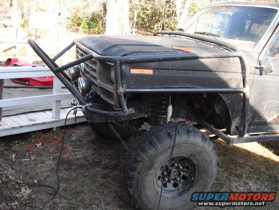 Modified SUV front end with brush guard and large tires