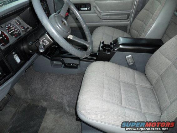 1994 Jeep Cherokee interior showing front seats, dashboard, steering wheel, and center console