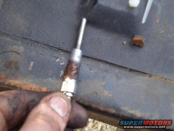 Glow plug held in hand