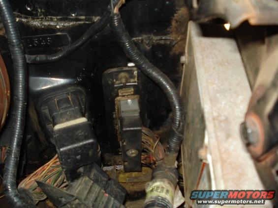 Engine bay wiring harness and fuse box with visible numbers '1545'
