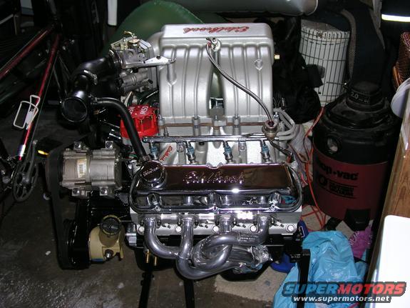 Chrome-plated valve covers and silver intake manifold on a Ford V8 engine