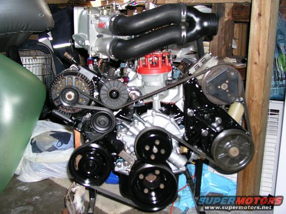 Engine with black hoses and red distributor cap