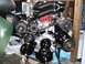 1996 Ford Bronco - A detailed view of a clean engine assembly, black hoses and a red distributor cap.