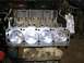 1996 Ford Bronco - Engine block with pistons installed, part number visible on the block.