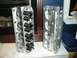 1996 Ford Bronco - Pair of aftermarket aluminum engine cylinder heads shown indoors.