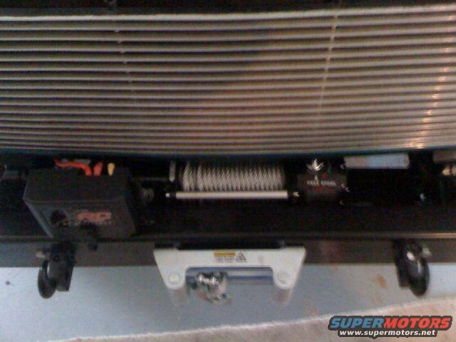 Winch and tow hook on front bumper