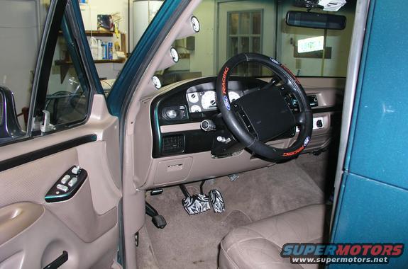 1996 Ford Bronco interior with aftermarket pedals and gauges