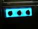 1996 Ford Bronco - Close-up of the illuminated climate control knobs in a vehicle's dashboard.