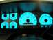 1996 Ford Bronco - The illuminated dashboard gauges of a 1996 Ford Bronco, showing speedometer, tachometer, fuel, and temperature readings.