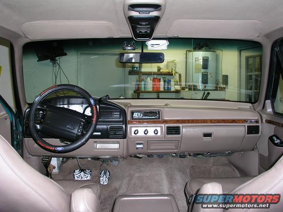 Interior of a 1996 Ford Bronco showing the dashboard, steering wheel, and seats