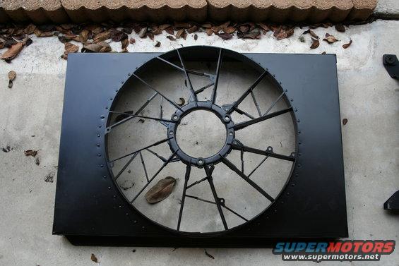Black radiator fan shroud with a large circular fan assembly