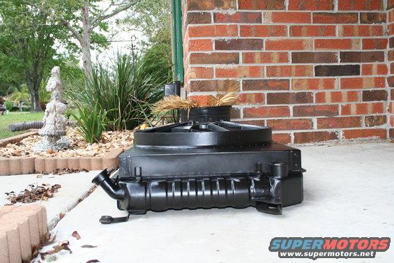 radiator and fan shroud sitting on concrete patio